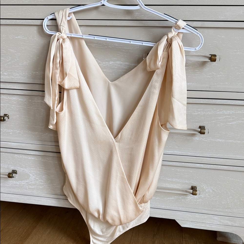 Elegant Cream Bodysuit with Tie Straps